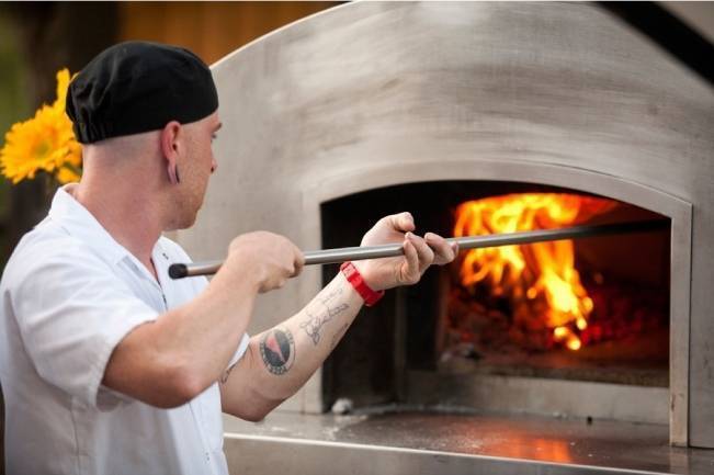 wood fire pizza oven at wedding