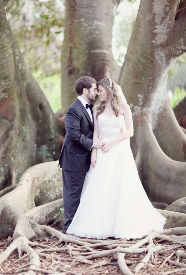 bride and groom under banyan tree