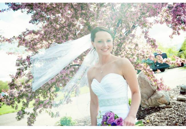 bride under cherry blossoms