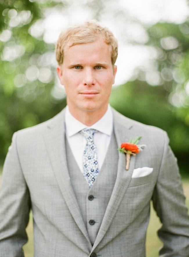 grey groom suit with orange boutonniere