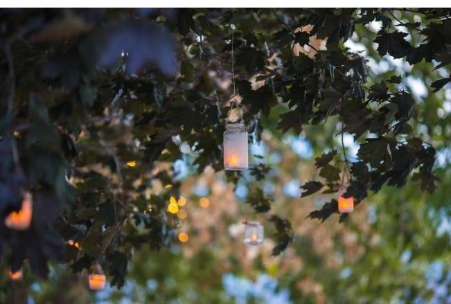 tea lights in trees - outdoor wedding lighting
