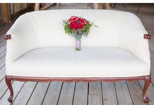 snow white settee with red flowers
