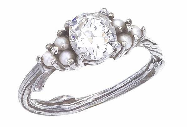 Engagement ring incorporating and antique diamond and cultured seed pearls 