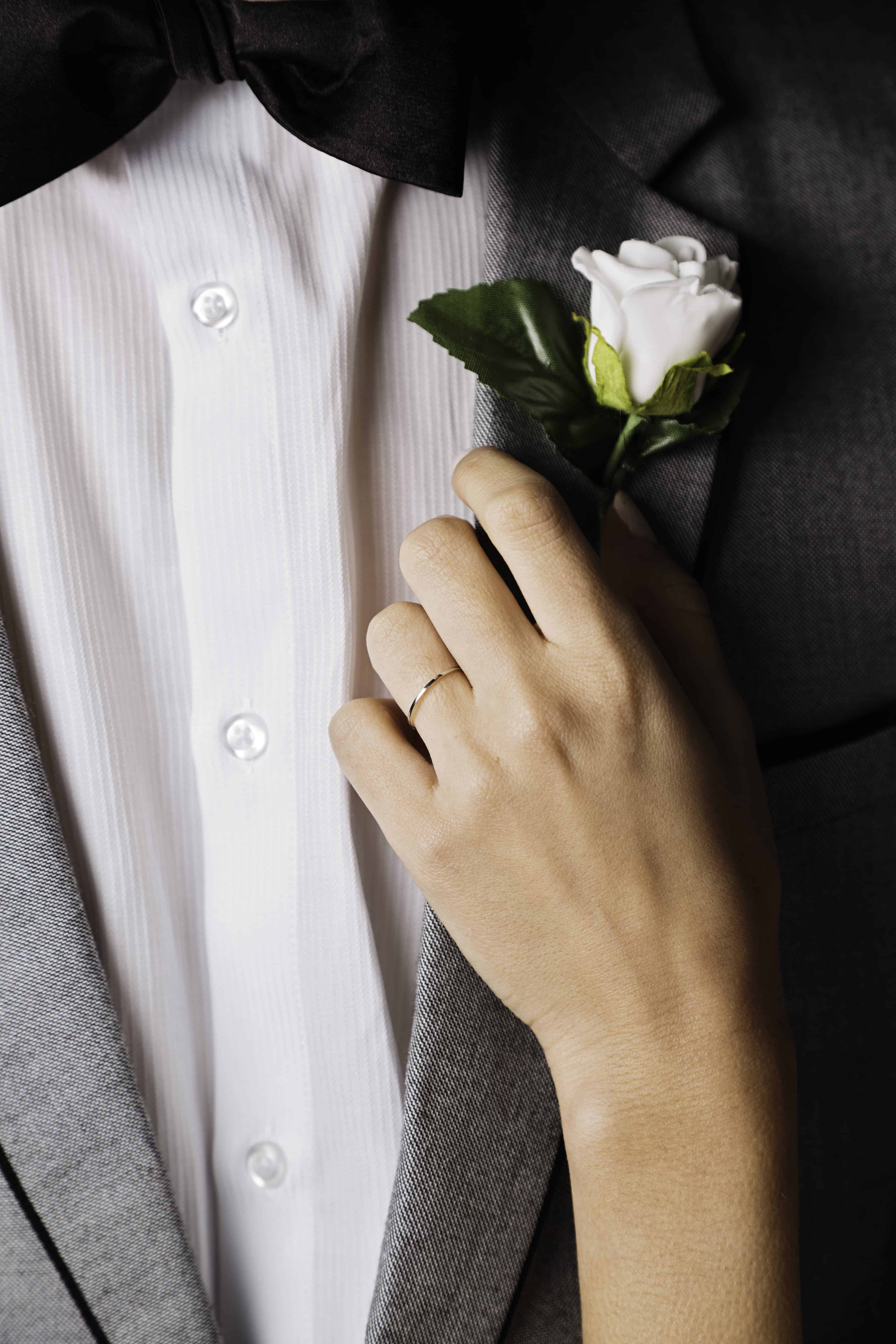 Person Holding White Rose