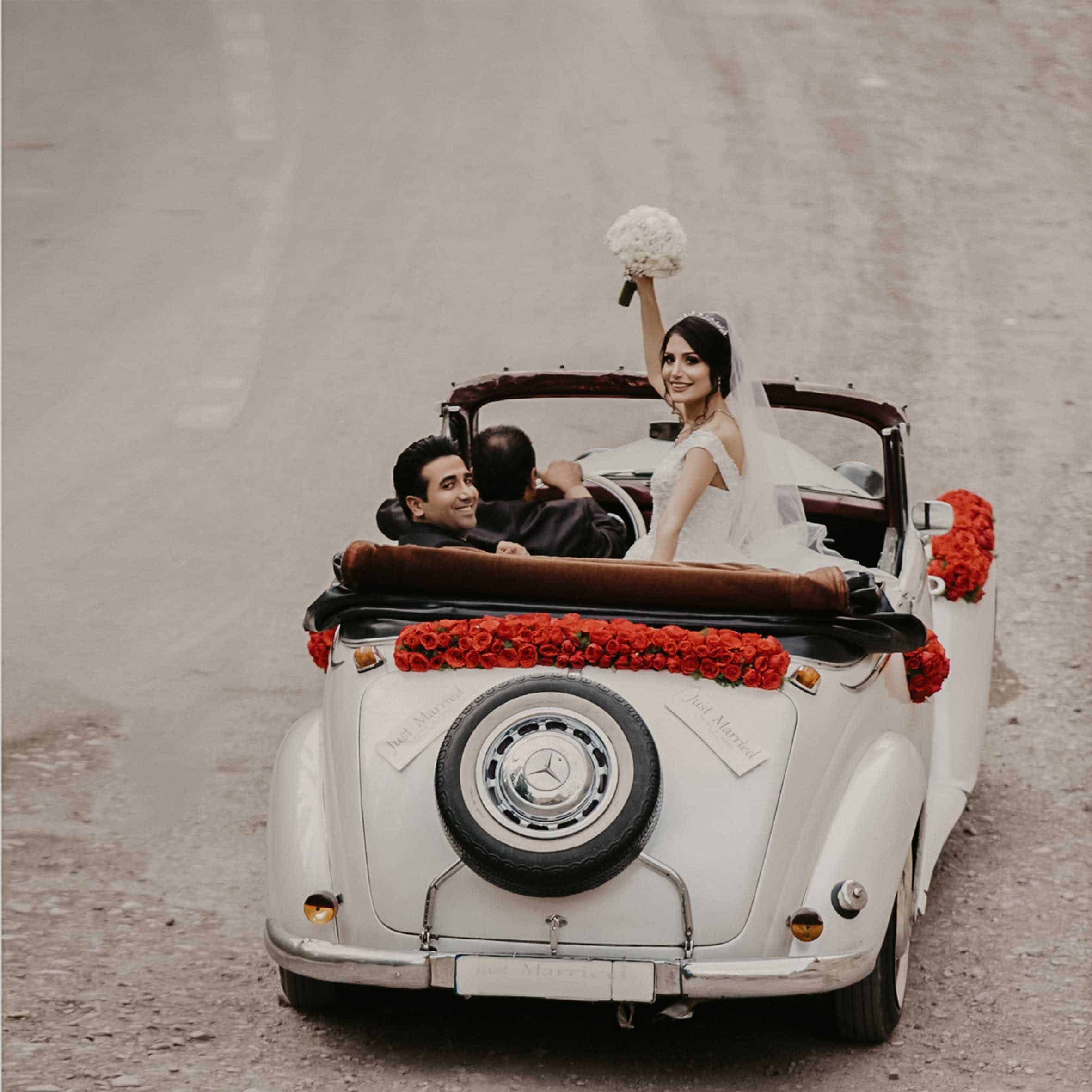Groom And Bride Riding On White Vehicle