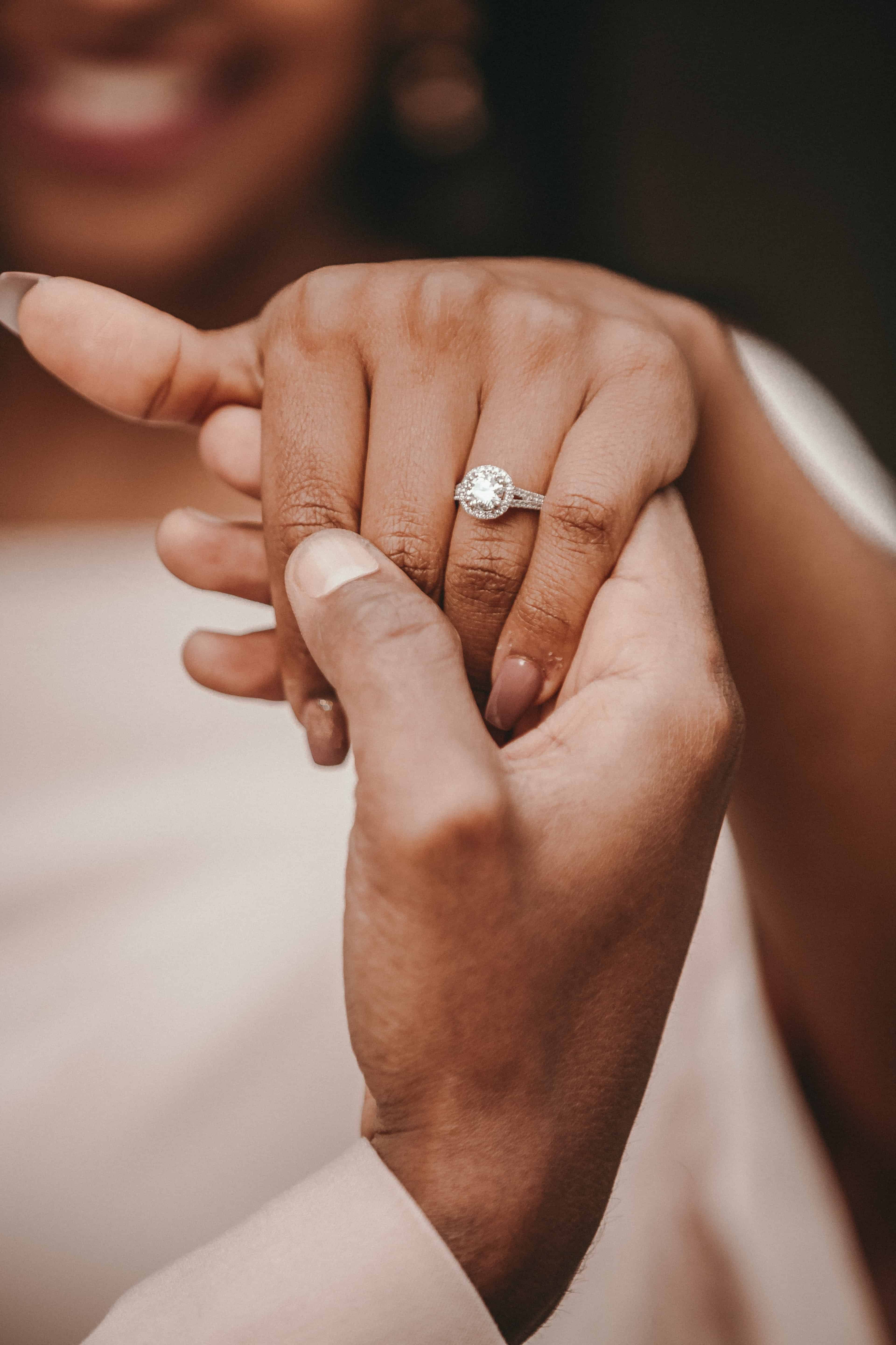 Engagement ring couple on sale hands