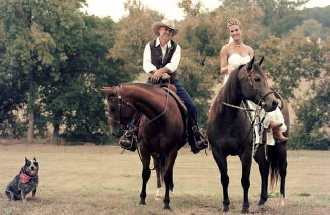 bride and groom riding horses