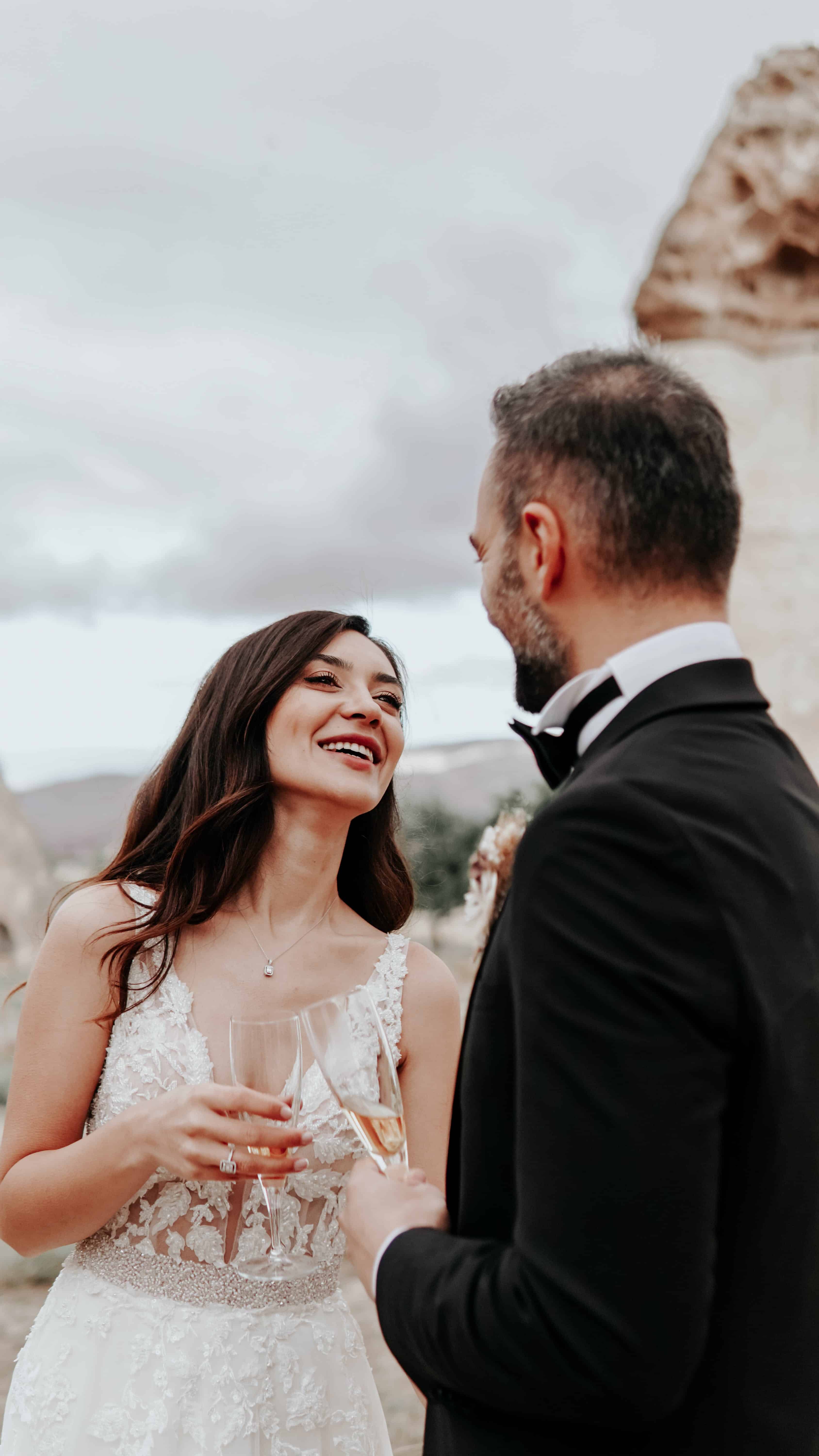 Free A Couple Having Conversation while Toasting Drinks Stock Photo