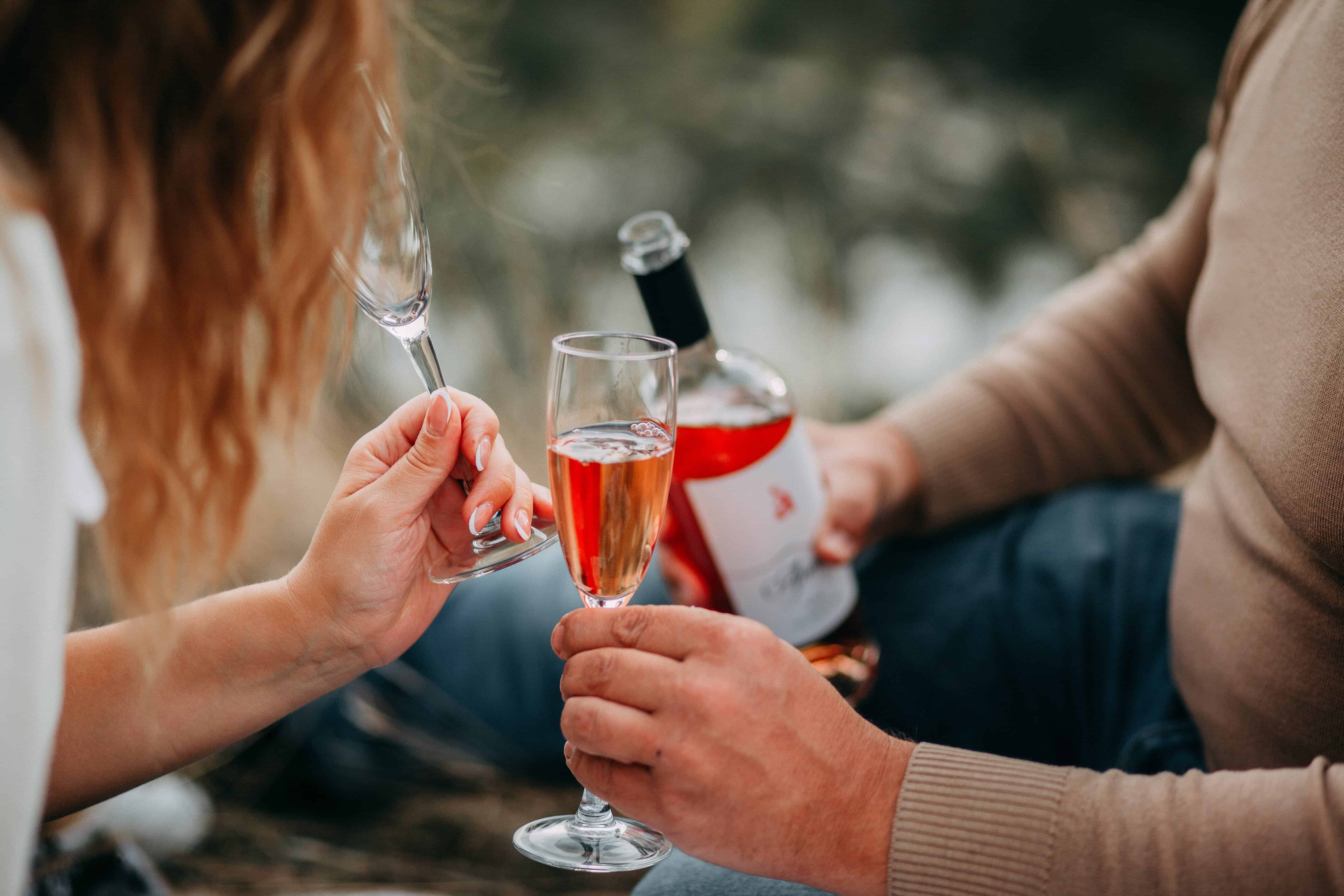 Free Two Persons Holding Glass Flutes While Drinking Stock Photo