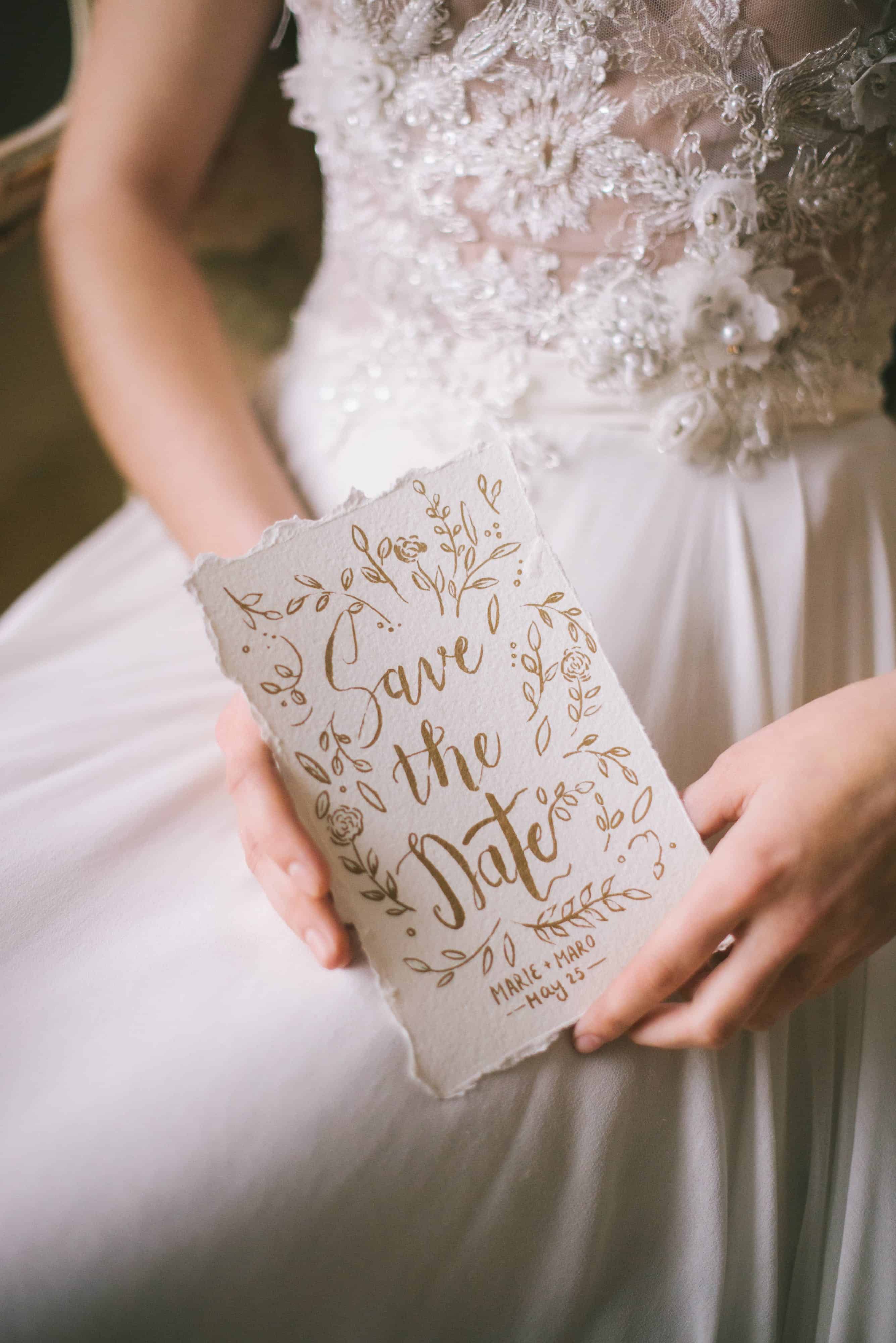 Free Woman in White Dress Holding a Wedding Invitation Stock Photo